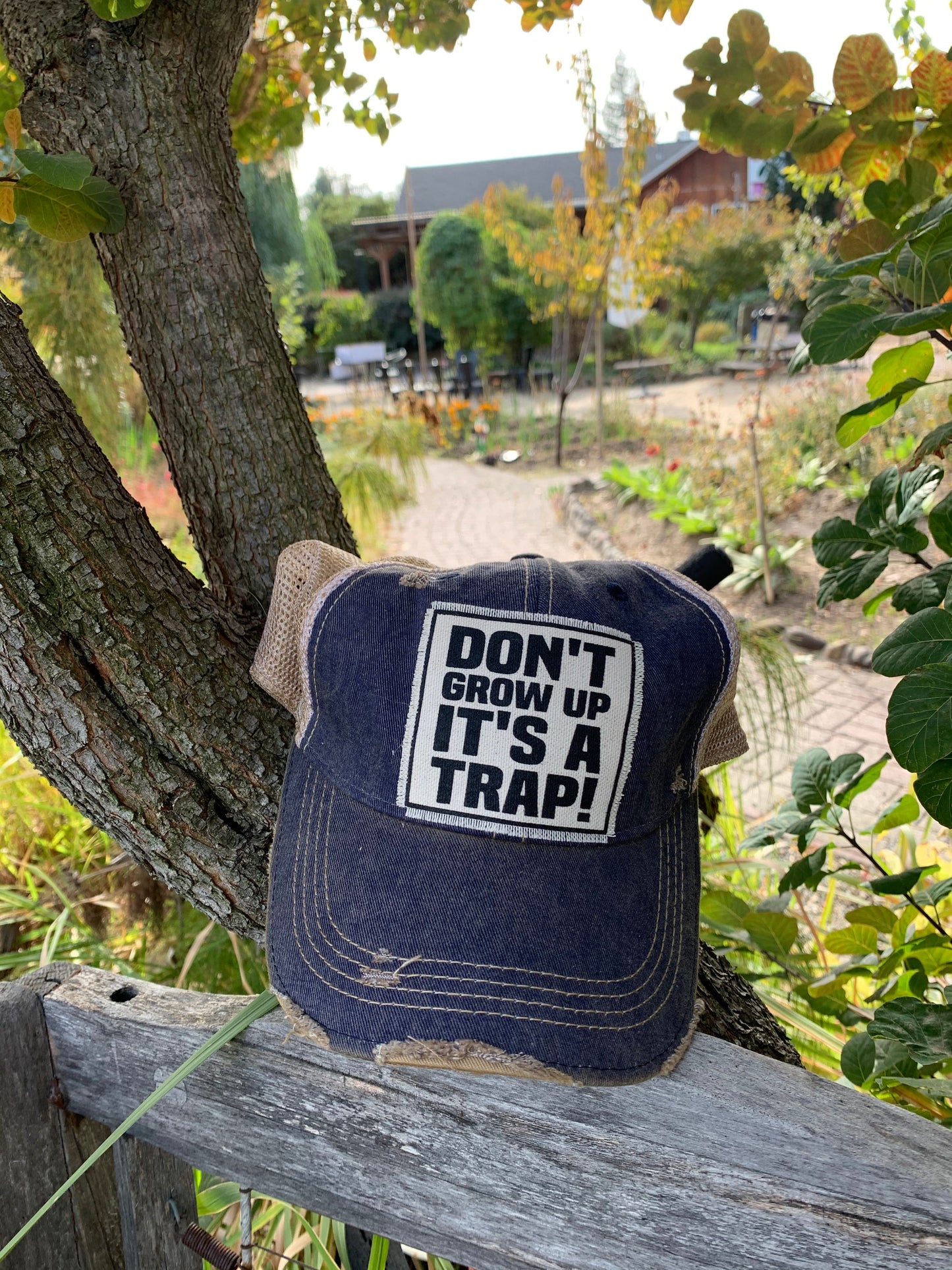 "Don't Grow Up It's A Trap" Distressed Trucker Cap