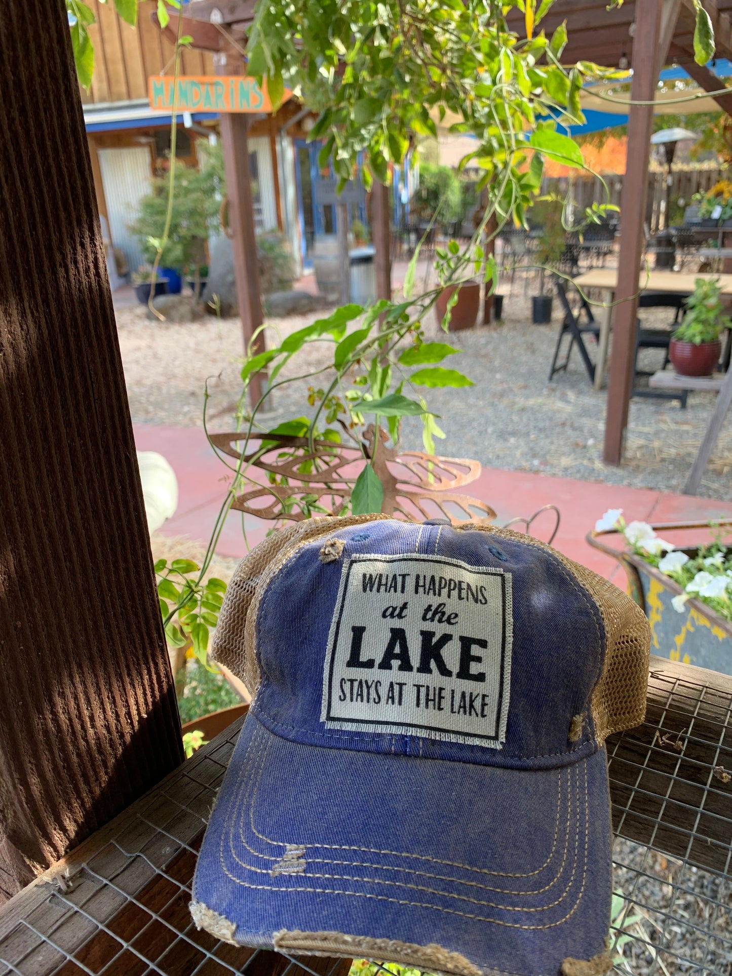 "What Happens At The Lake Stays At The Lake" Distressed Trucker Cap