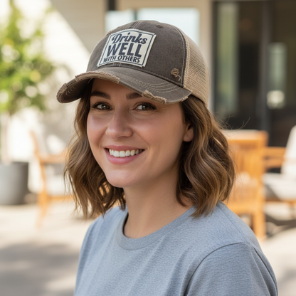 "Drinks Well With Others" Distressed Trucker Cap