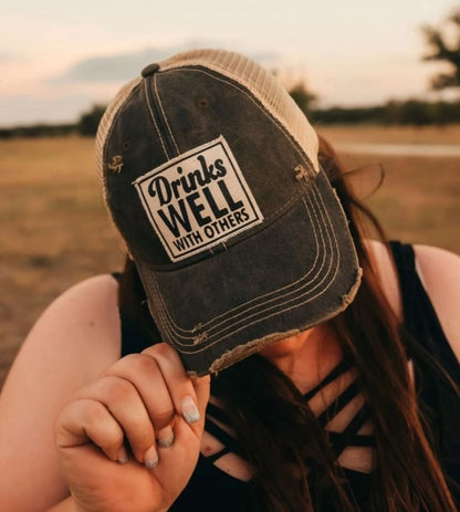 "Drinks Well With Others" Distressed Trucker Cap